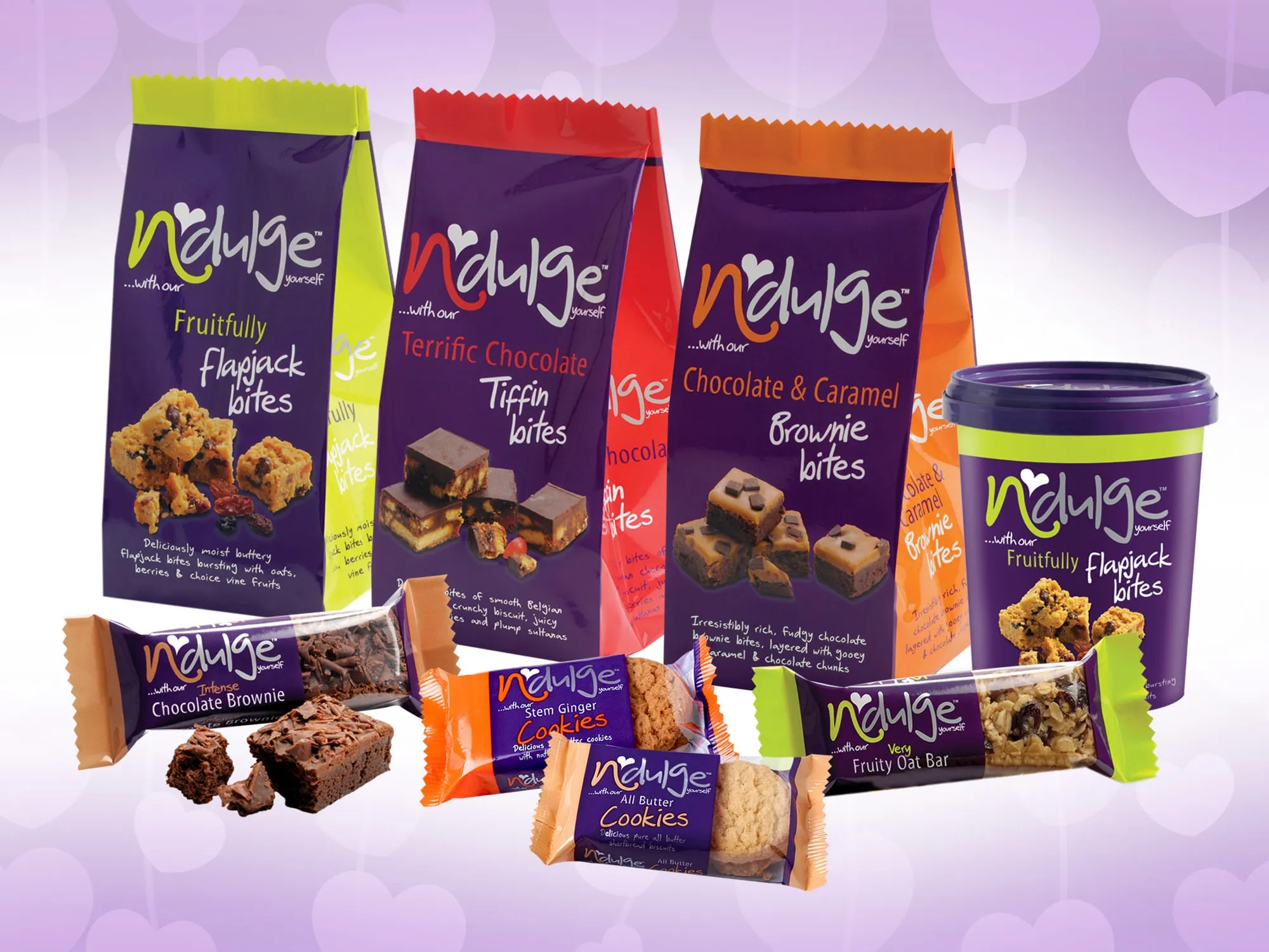 Indulge flapjack, tiffin and brownie bites packs, snack bars and a tub.